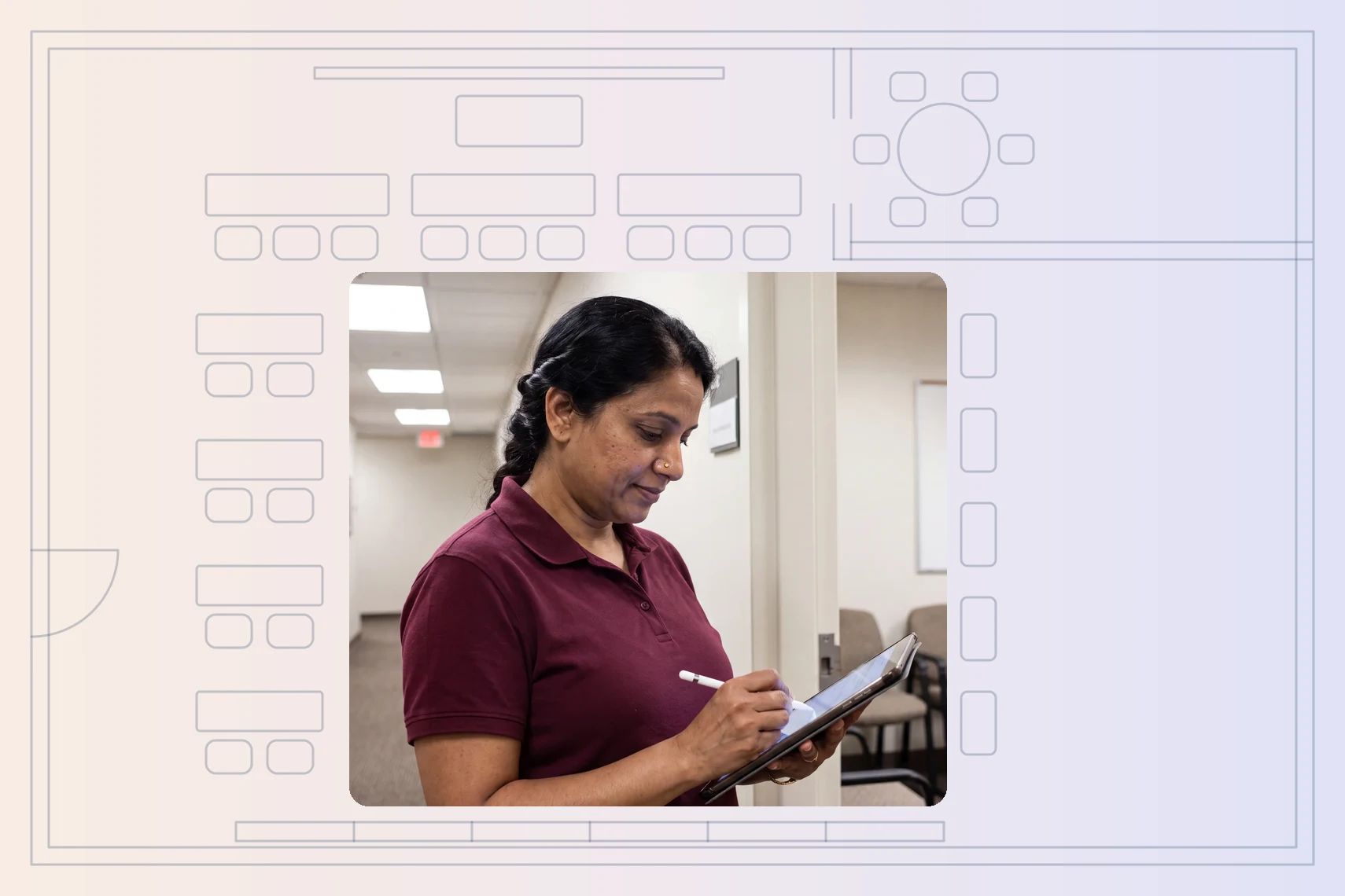 Trainer marking attendance on tablet at training-room doorway