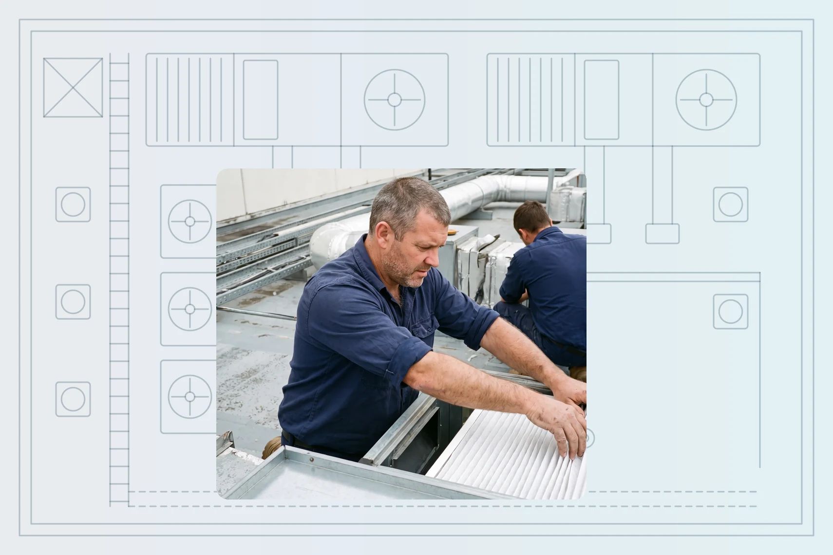 Technician sliding fresh filter into rooftop AHU, colleague at next unit